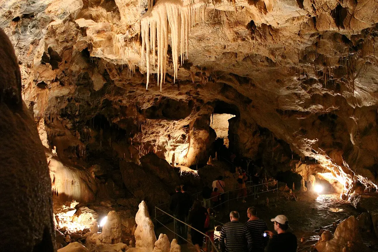 Stalactites and illuminated rock formations inside Bear Cave at Chiscau in Bihor county