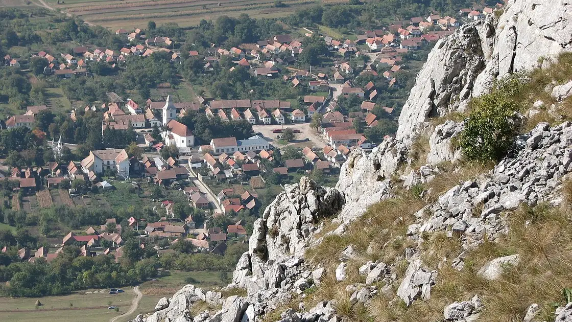 White plastered village houses with red roofs in Rimetea in the Apuseni foothills