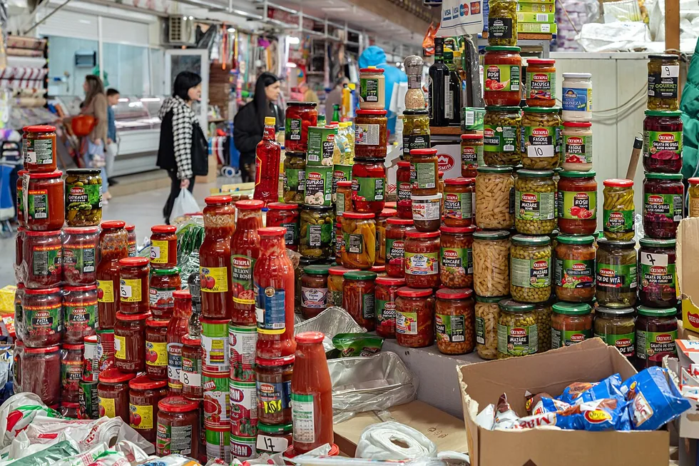 Produce stalls at Obor Market in Bucharest, crates of vegetables under a covered hall