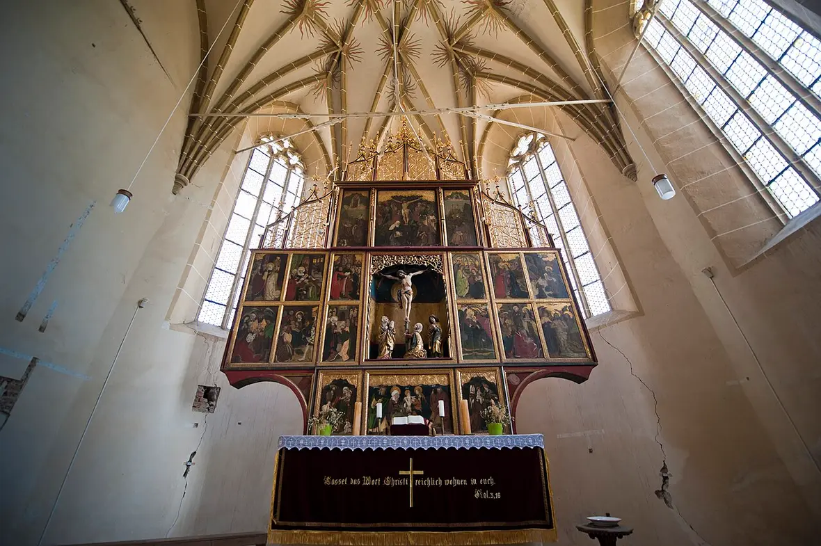 The great multi-panelled Gothic altarpiece of Biertan filling the chancel below rib vaults