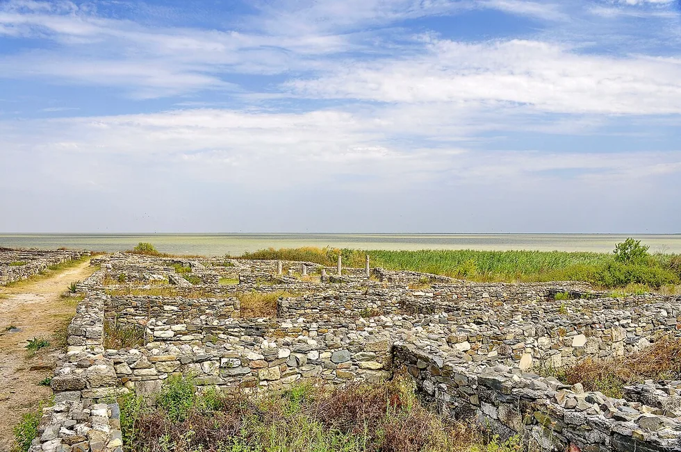 Stone ruins of ancient Histria fortress beside Lake Sinoe in Dobrogea