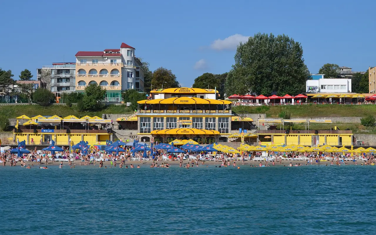 Sandy beach and Black Sea shoreline at Eforie Nord on a summer day