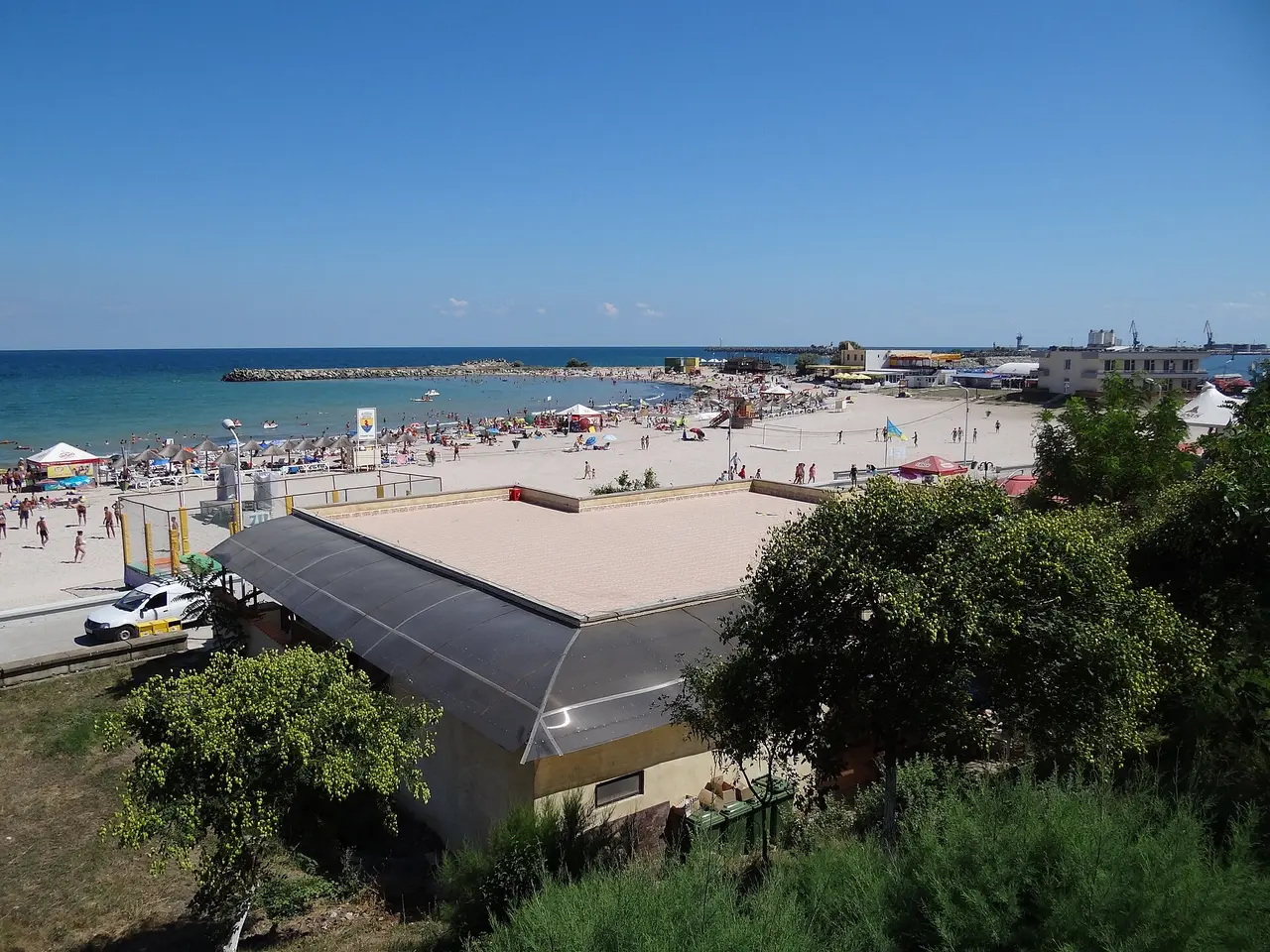 Long sandy beach at Mangalia with sunbeds facing the Black Sea
