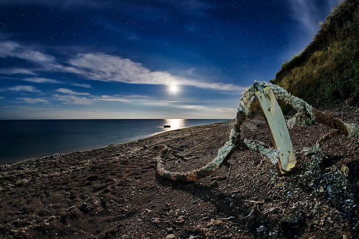 Night scene on the beach at Vama Veche with lights along the sand