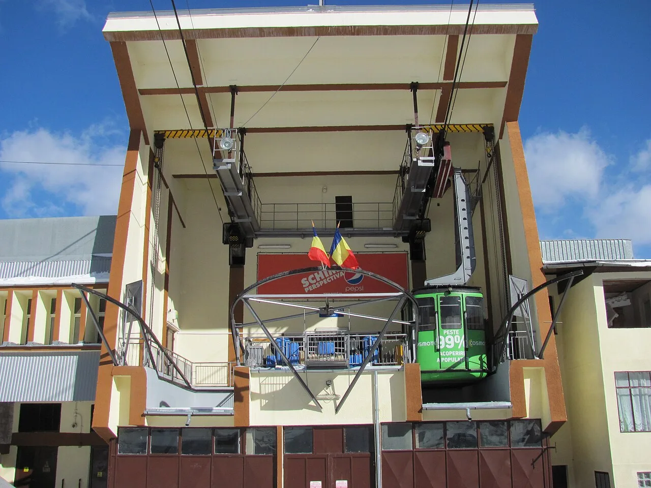 The lower station of the Busteni-Babele cable car with its concrete pylons and valley backdrop
