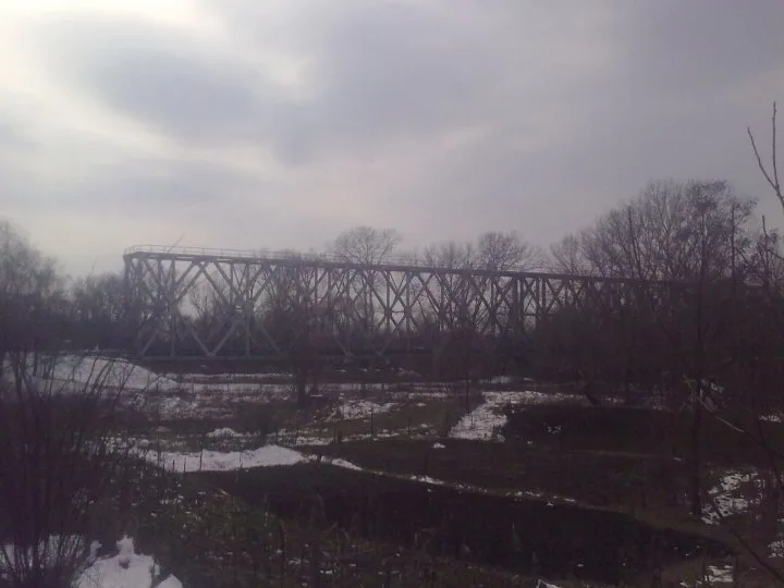 The old iron rail bridge over the Prut river at Ungheni, its lattice girders spanning the water between Romania and Moldova
