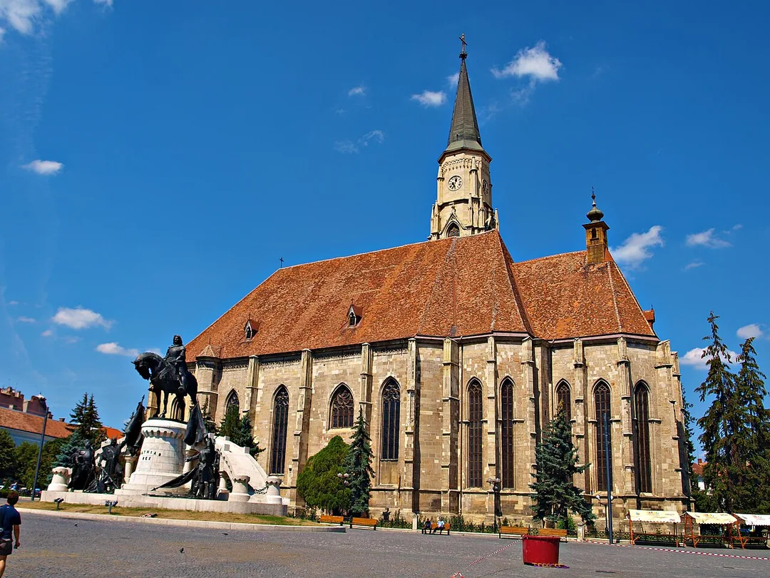 The tall Gothic St Michaels Church and the Matthias Corvinus statue in the centre of Cluj-Napoca