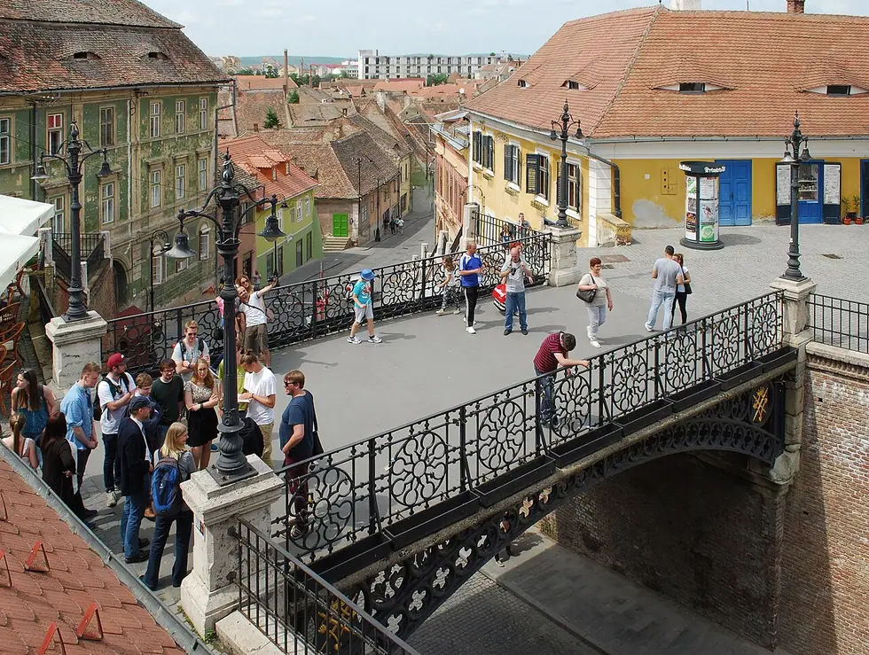 The cast-iron Bridge of Lies arching over Ocna Street in Sibiu, linking the Large Square and Lower Town