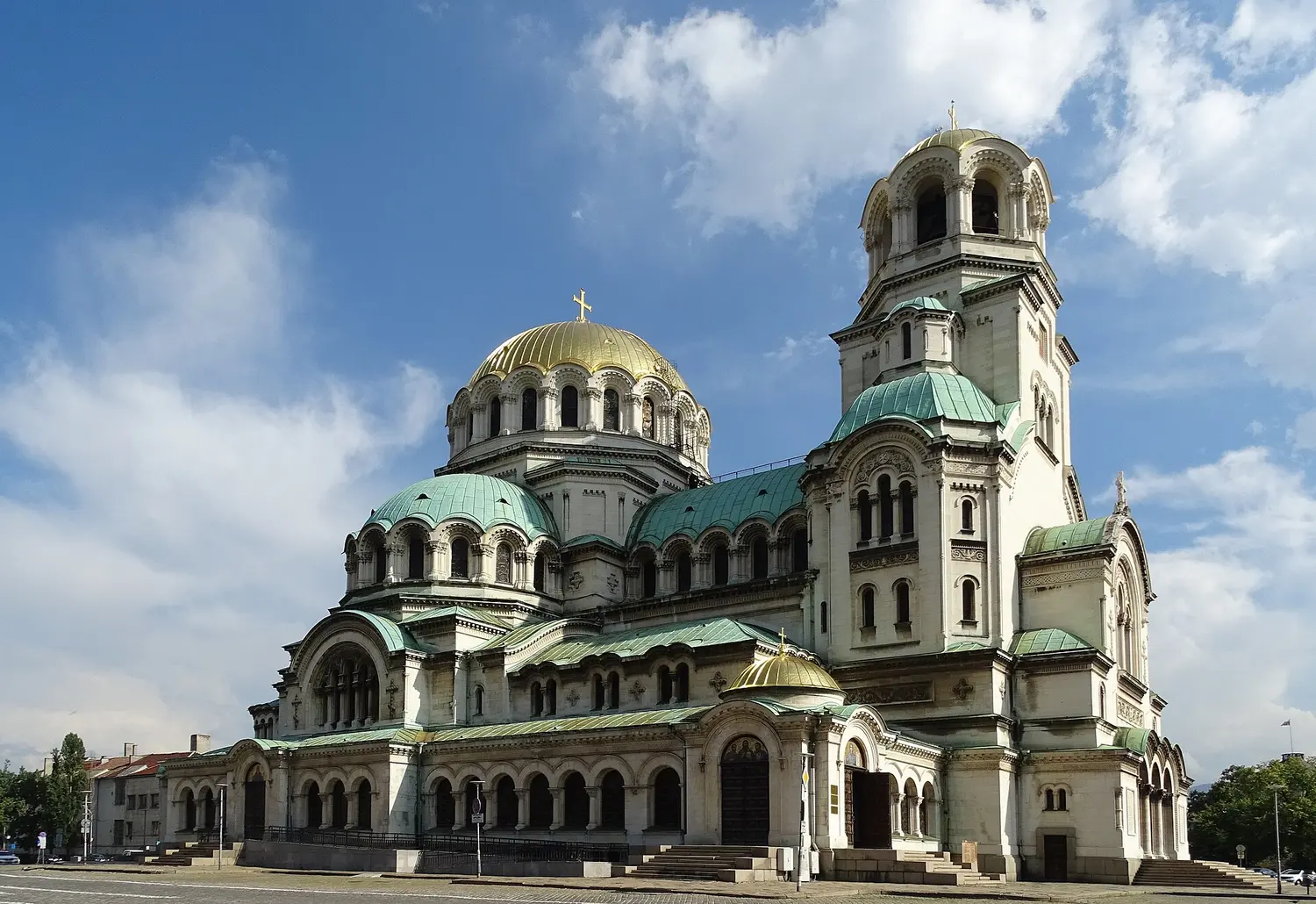 The Alexander Nevsky Cathedral in Sofia with its gold and green domes against a blue sky, the landmark that greets arrivals in the Bulgarian capital