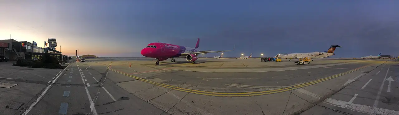 Wide view of the apron and runway area at Timisoara Traian Vuia airport