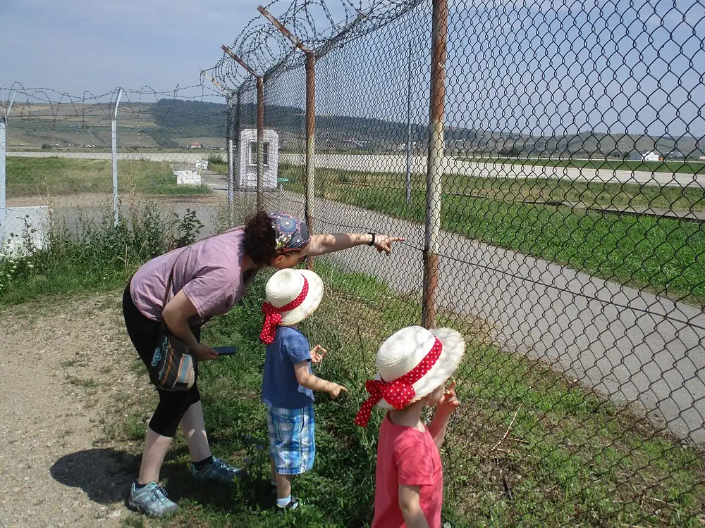 View of Cluj-Napoca Airport apron and terminal buildings from outside the perimeter fence