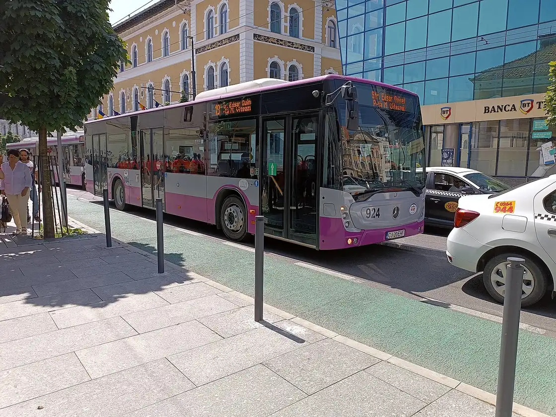 Blue Mercedes-Benz Conecto city bus operated in Cluj-Napoca stopped on an urban street
