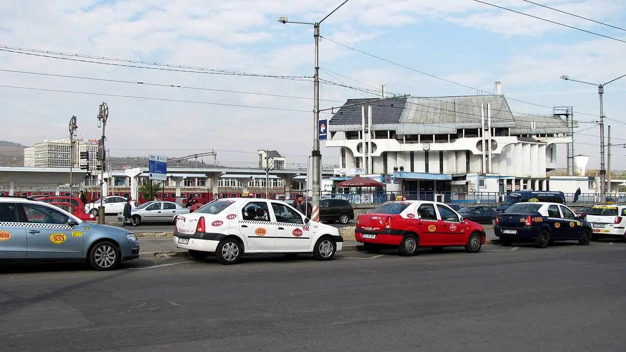 Yellow taxis lined up on Piața Gării in Cluj-Napoca near the railway station