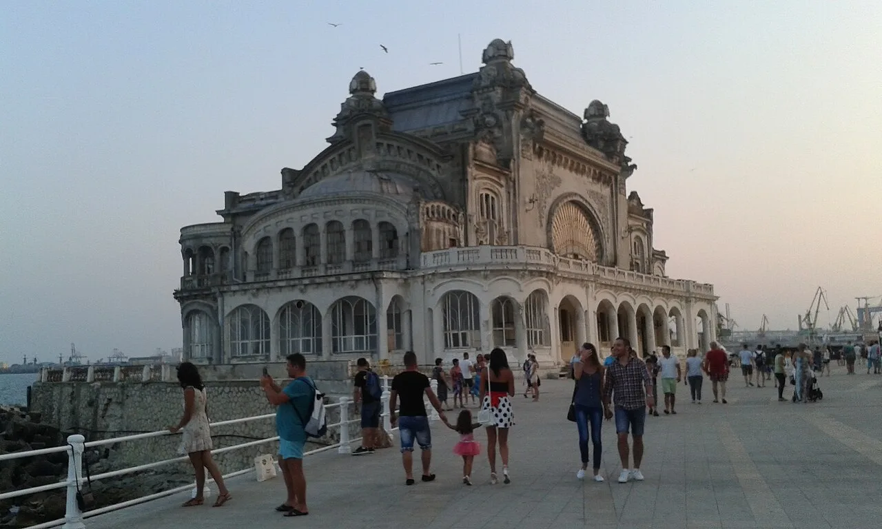 The Constanta Casino seen along the seafront, a curved white Art Nouveau building above the promenade