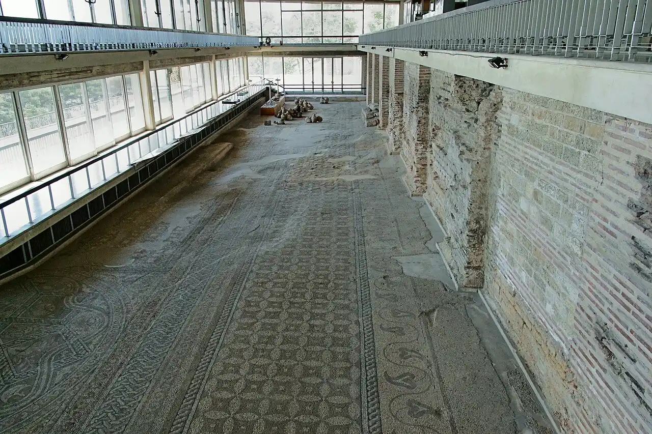The vast Roman mosaic floor of Tomis under its protective hall, with the sea and port visible beyond