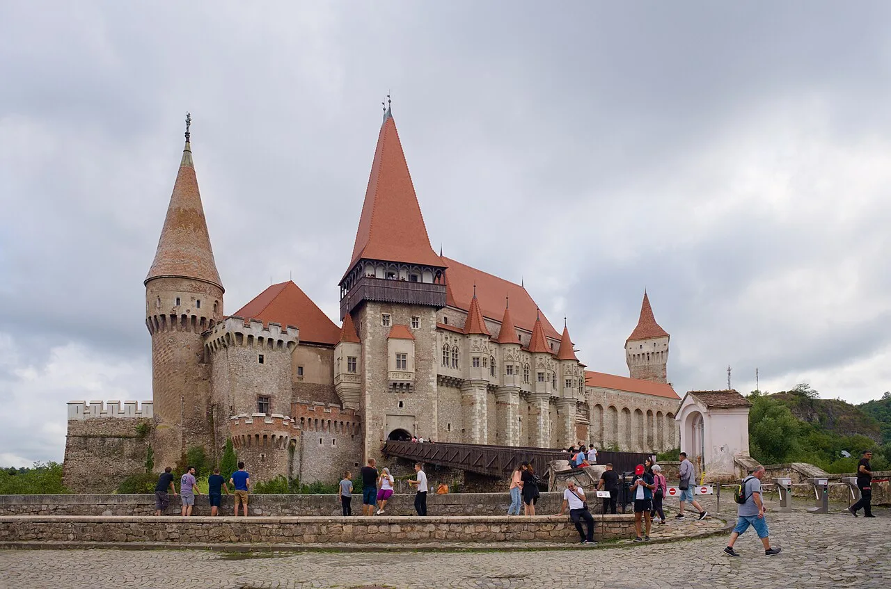 Corvin Castle in Hunedoara with its red-tiled towers, tall keep and covered wooden bridge, the largest Gothic castle in Transylvania