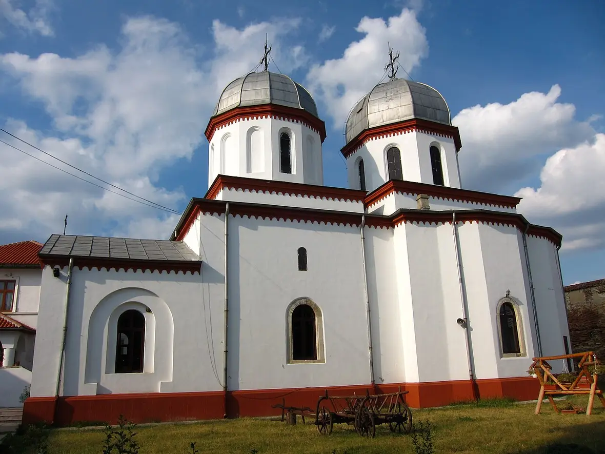 The church of Comana Monastery in Giurgiu county, with its arcaded porch and painted facade