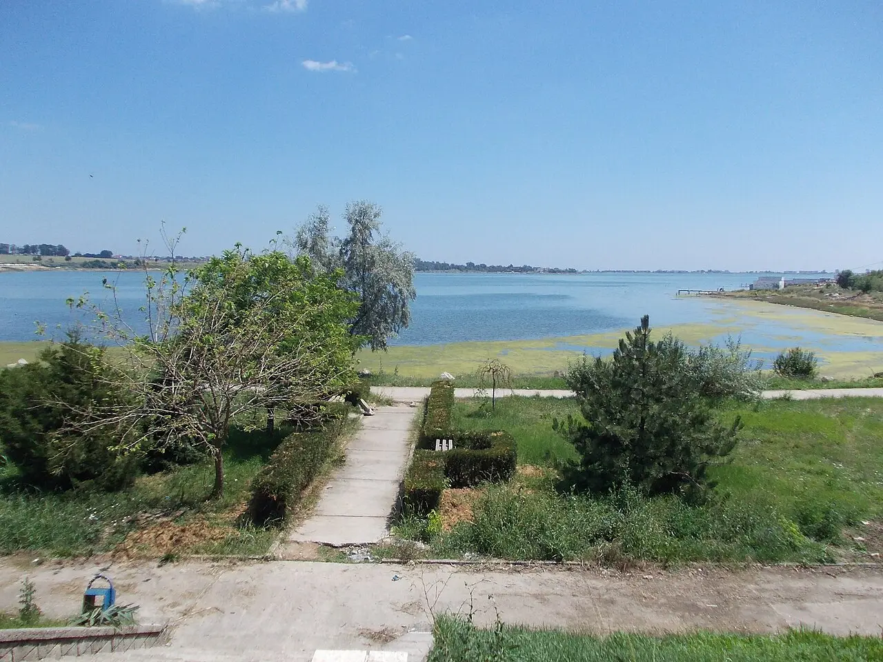 Open grey-blue waters of Lake Techirghiol with low shores and open sky