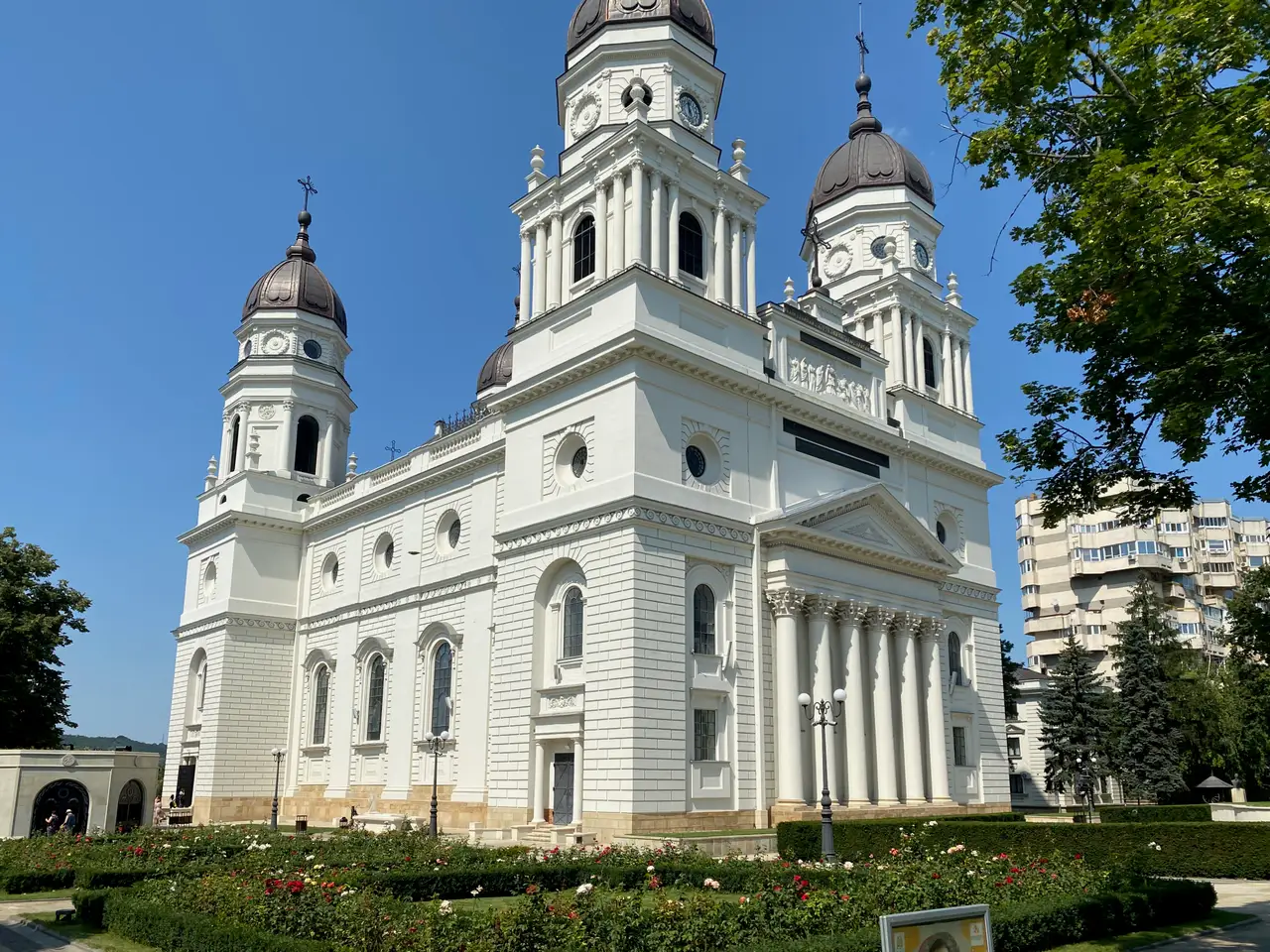 The large yellow Metropolitan Cathedral in Iasi with its four corner towers, seen from the square in front