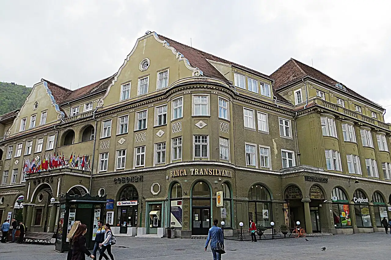 A Banca Transilvania branch on a city square in Brasov, the kind of bank whose ATMs are the safest to withdraw lei from