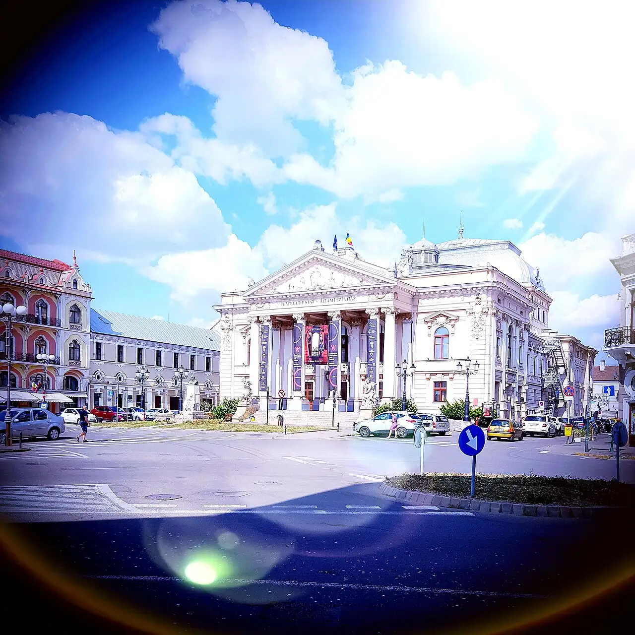 The Oradea State Theatre, a cream neoclassical building by the Viennese firm Fellner and Helmer, on Ferdinand Square