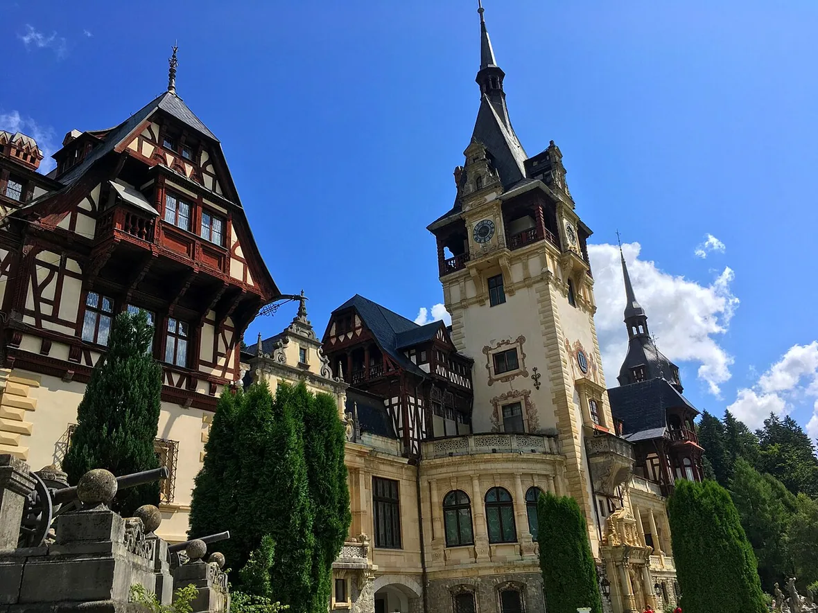 The ornate facade and turrets of Peles Castle in Sinaia, the starting point of the drive to Bran