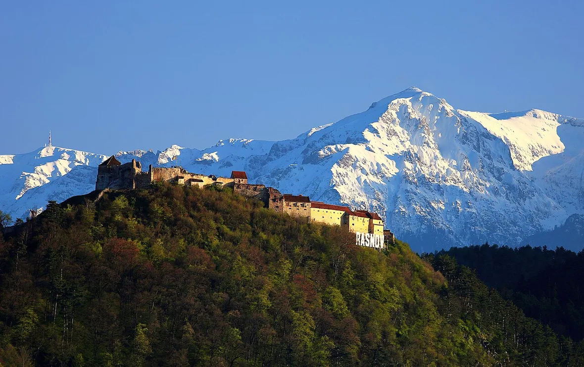 Rasnov citadel on its hill seen from the Cristian to Rasnov road, the route between Brasov and Bran