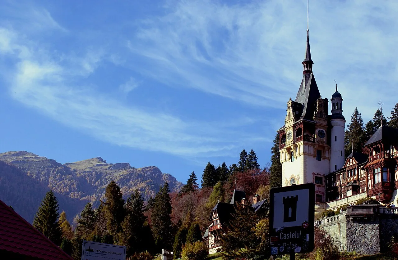 The mountain town of Sinaia spread across the forested Prahova Valley under the Bucegi peaks