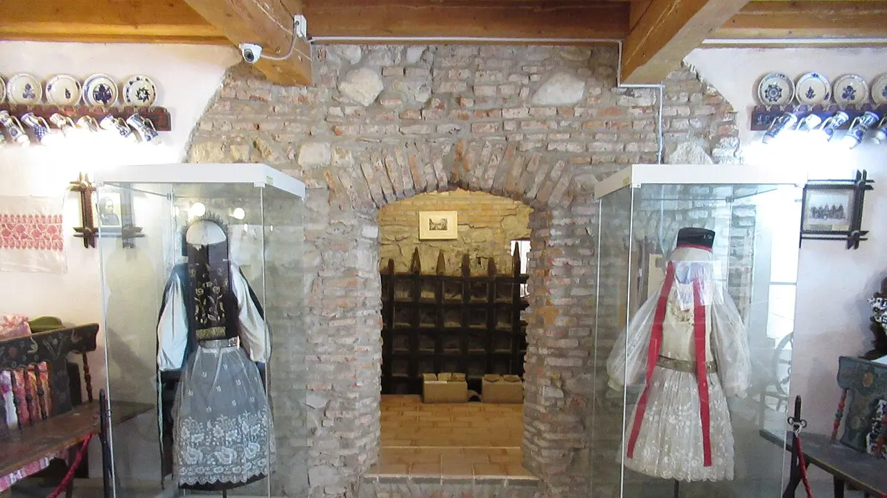 Red-roofed fortified church of Prejmer rising inside thick oval defensive walls