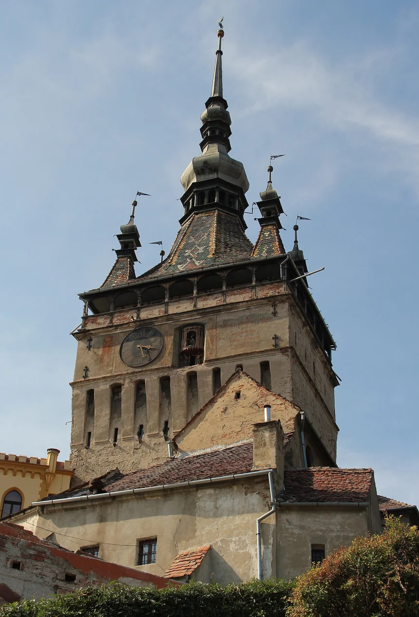 The tall medieval Clock Tower gate of the Sighisoara citadel with its coloured tiled roof