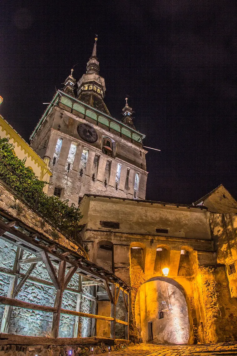 The Clock Tower gate of Sighisoaras medieval citadel lit up at night