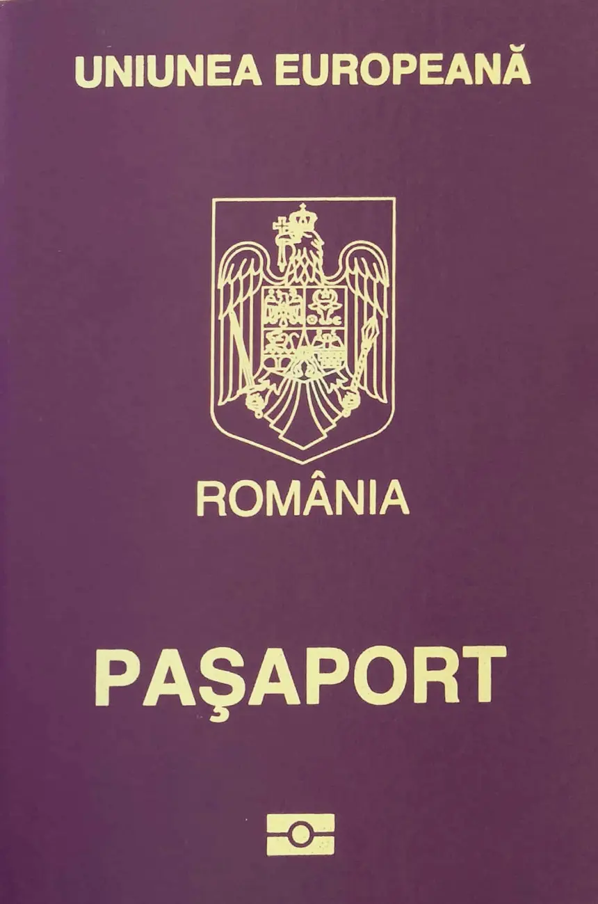 The burgundy cover of a Romanian European Union biometric passport, showing the coat of arms, the words Romania and Pasaport, and the chip symbol