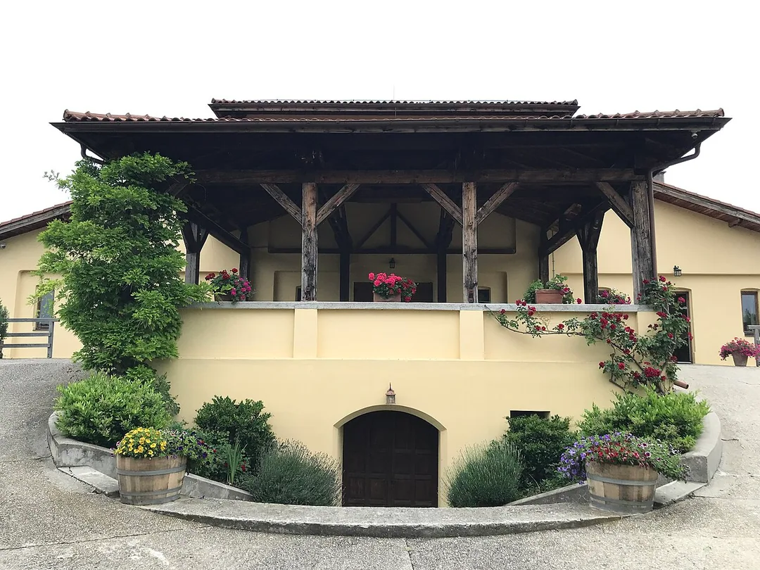 The Stirbey winery building at Dragasani in southern Romania, a low estate house behind a lawn