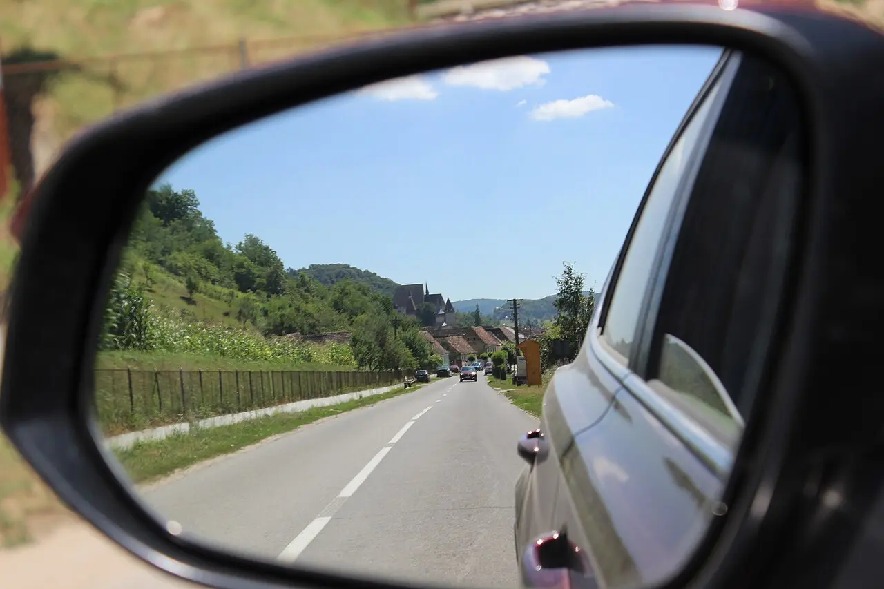 Biertan village and its hilltop fortified church seen from the approach road