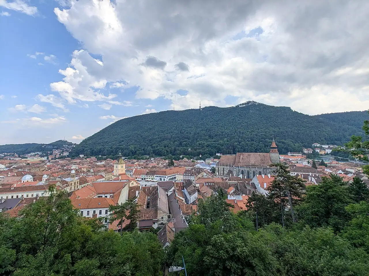 Panorama of Brasov old town with the Black Church and Mount Tampa behind it