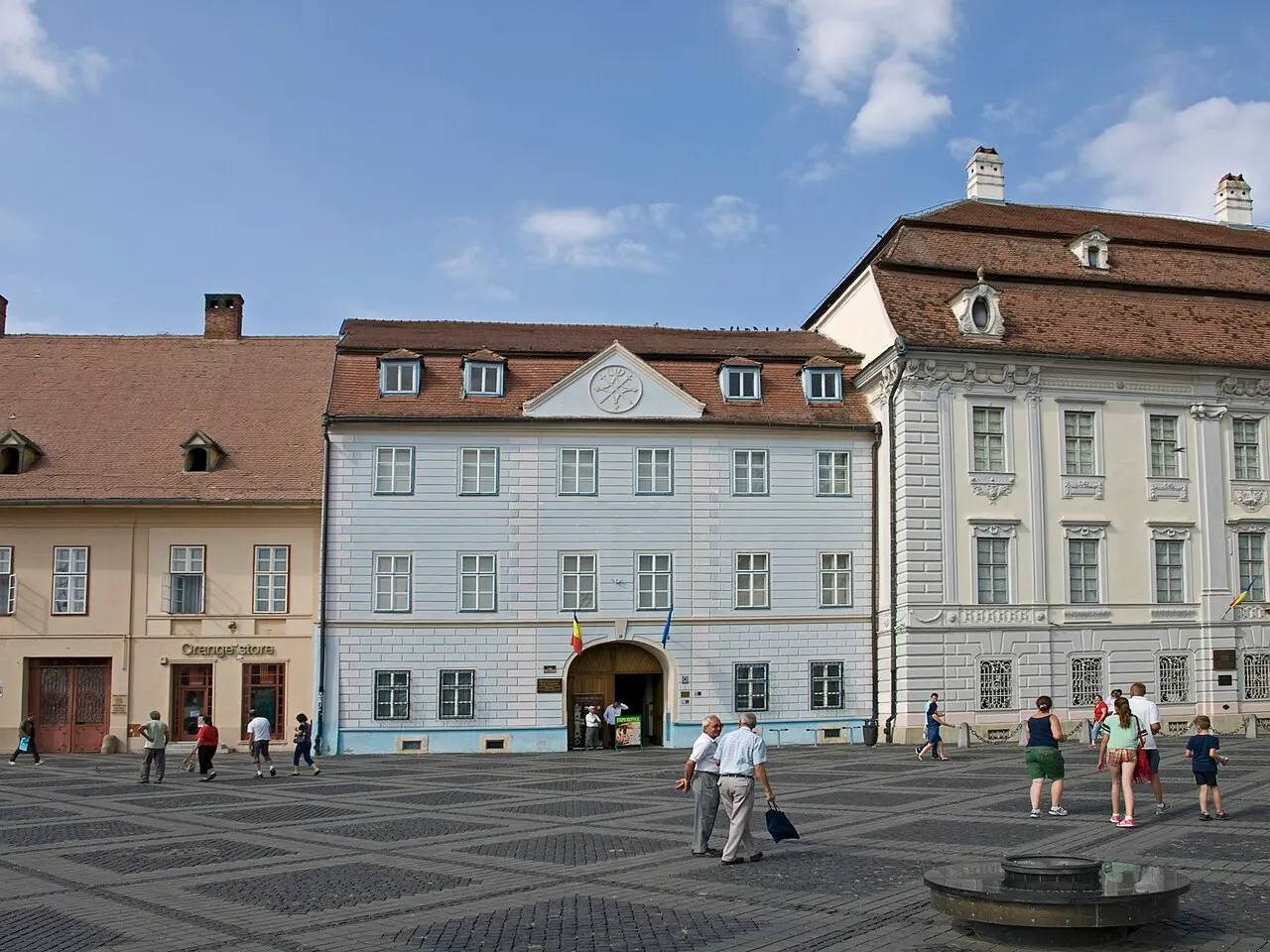 The Blue House on the Large Square in Sibiu, a bright blue Baroque townhouse with painted stucco