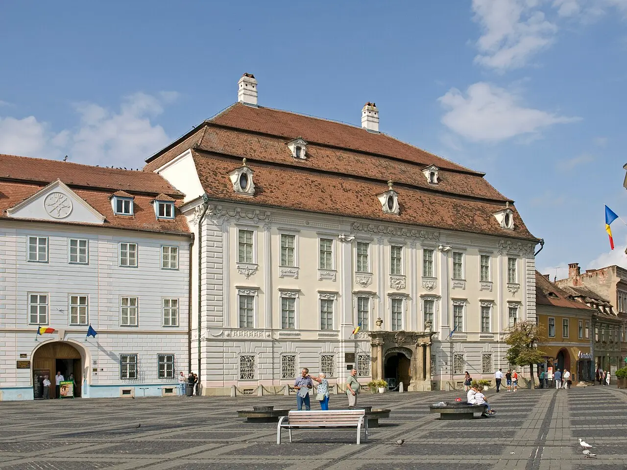 The Baroque facade of the Brukenthal Palace on the Large Square in Sibiu, honey-coloured stone with an ornate portal