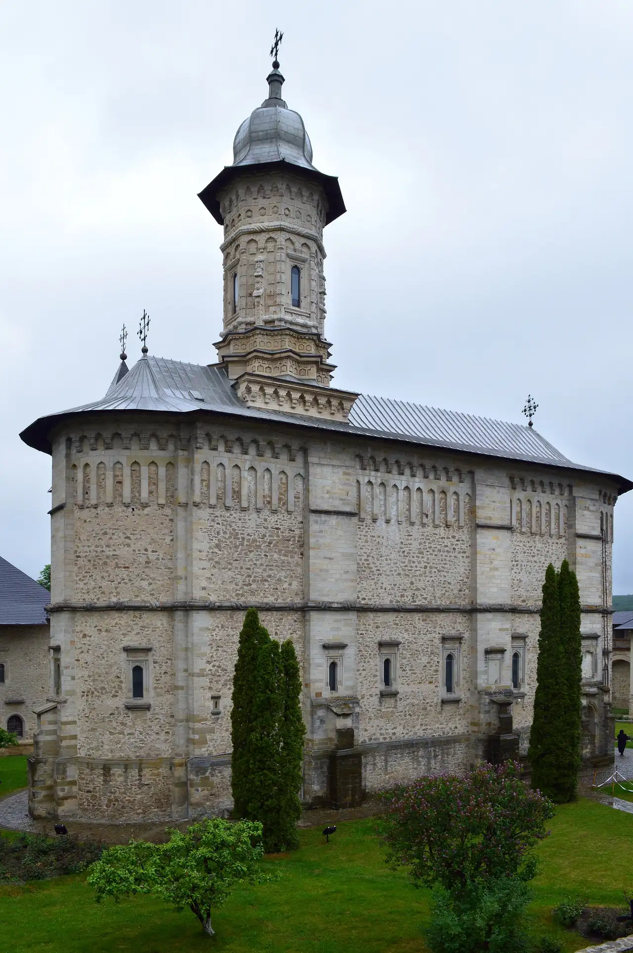 The tall stone church of Dragomirna Monastery rising inside its high fortified walls north of Suceava