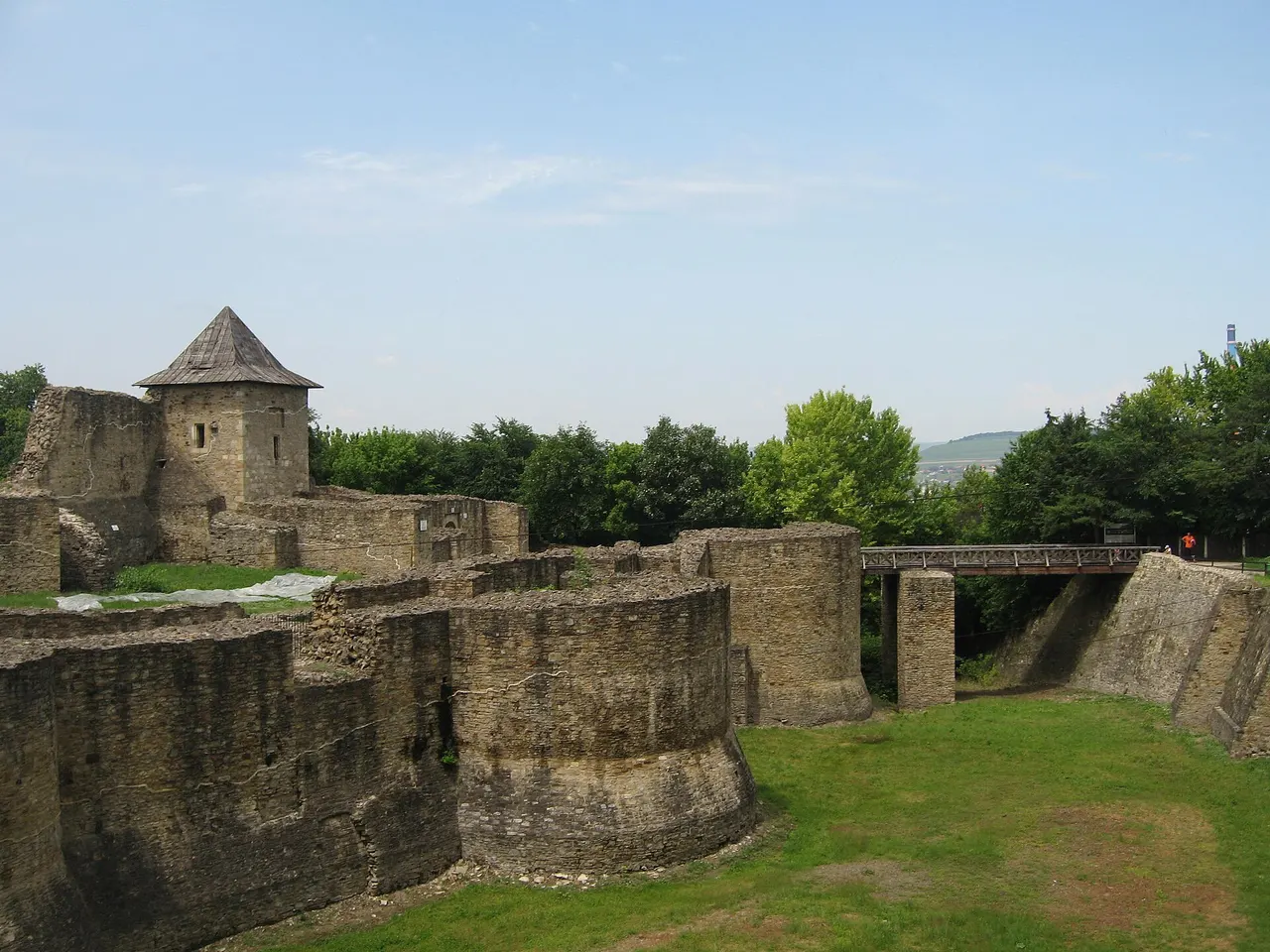 The stone walls and entrance of Suceava Seat Fortress seen from the approach path