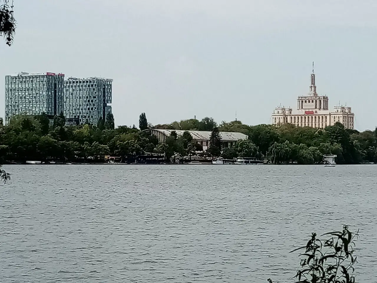 The Casa Presei Libere tower seen across the lake in northern Bucharest, with modern office blocks alongside