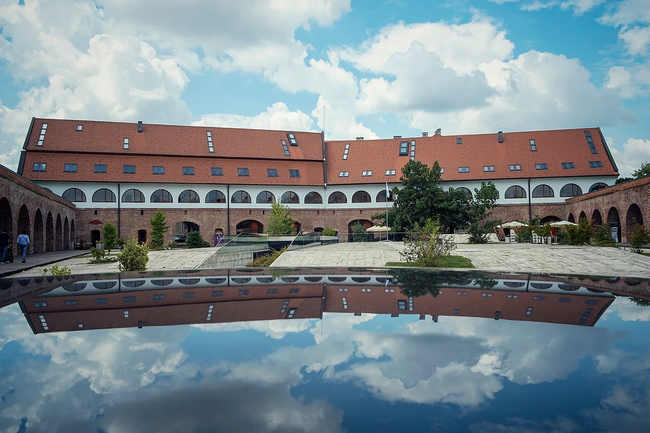 The long brick wall of the Maria Theresia Bastion in Timisoara, a surviving 18th-century Habsburg fortress bastion now full of shops and cafes