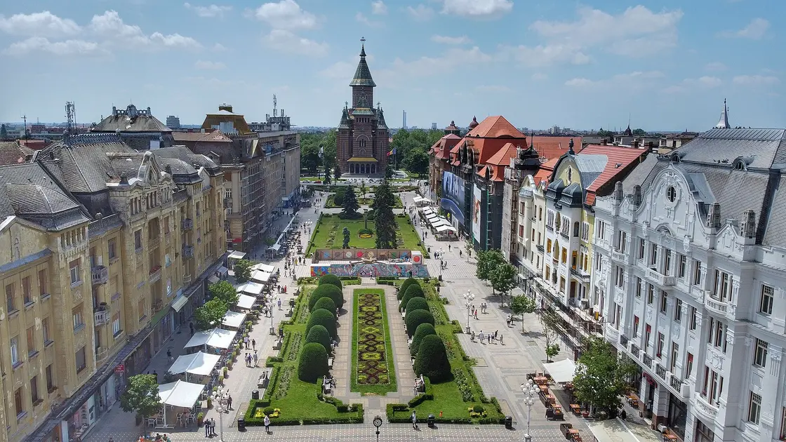Piata Victoriei in Timisoara, the long central square with the Orthodox Cathedral at one end and Secession facades along both sides, the starting point for the trip to Belgrade
