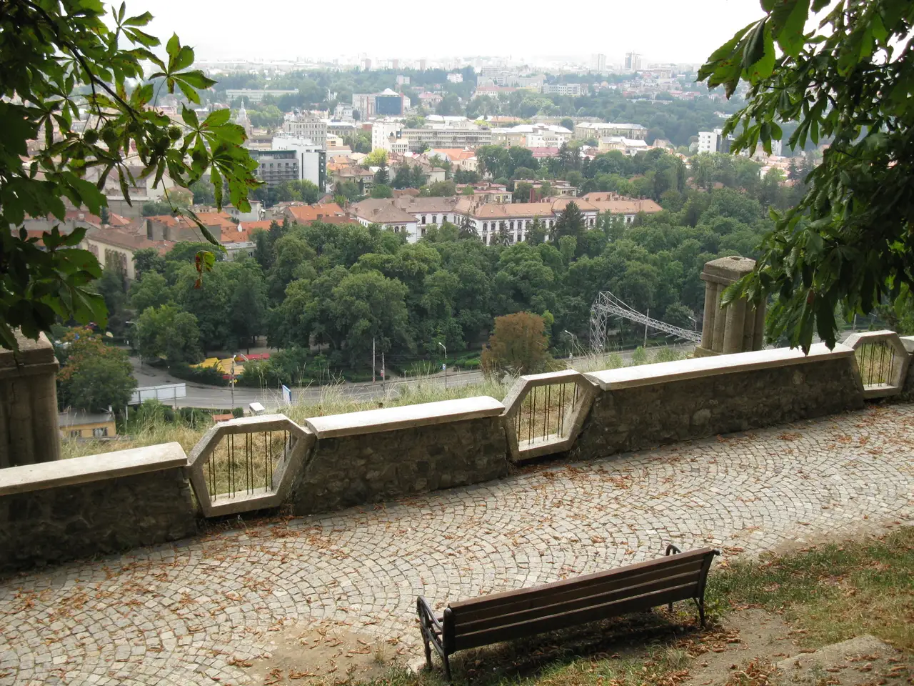 A hillside view over the rooftops and green parks of Cluj-Napoca from one of the viewpoints ringing the city