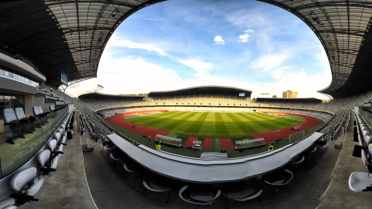 Empty covered stands and running track of Cluj Arena under a blue sky, the stadium that hosts Untold festival every August