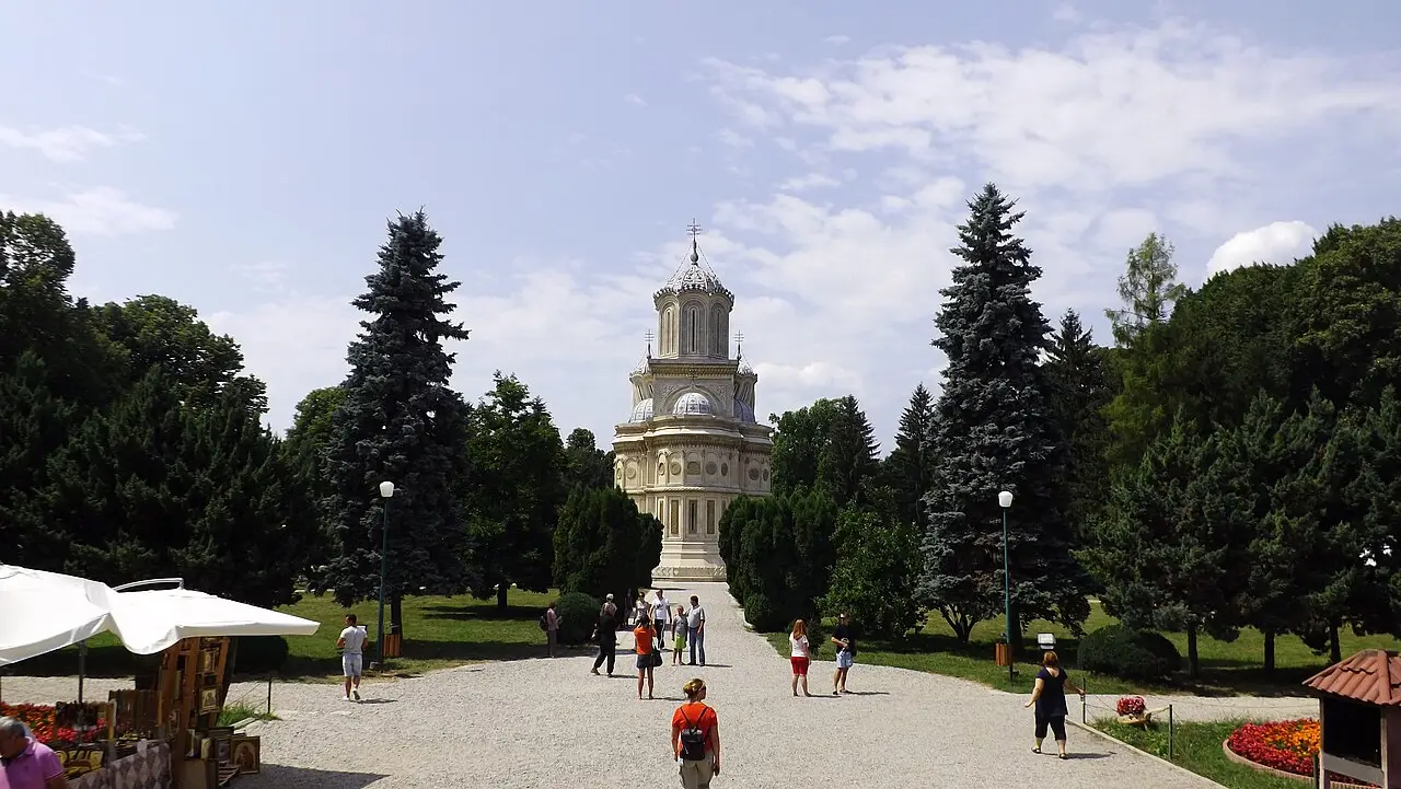 The twin-spired Curtea de Arges monastery church under a summer sky, royal necropolis of Wallachia