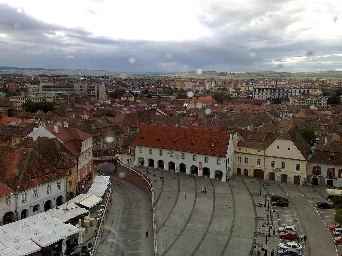 Piata Mica and the iron Bridge of Lies in Sibiu, marking the edge where the Upper Town meets the descent to the Lower Town