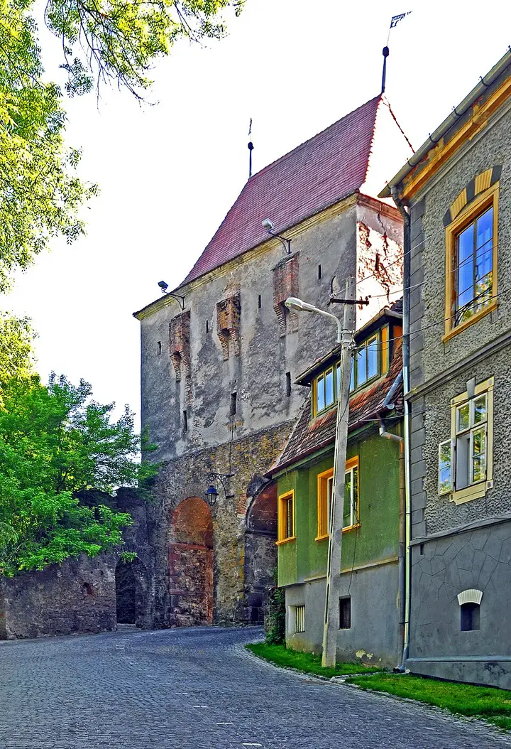 The Tailors Tower on the Sighisoara citadel wall, a tall stone gate tower with a pointed roof
